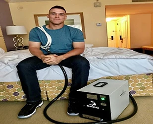 PEMF Therapy being performed on a patient's shoulder