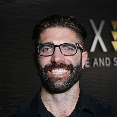 A headshot photo of Dr. Cameron Call, chiropractor at Axis Spine and Sport - Tempe