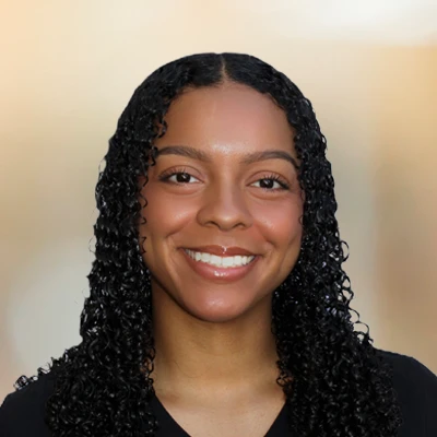A headshot photo of Myra