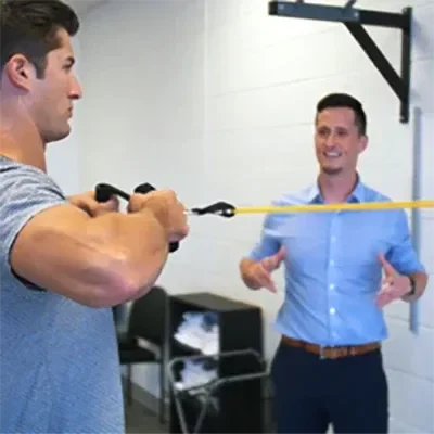 A patient using resistance bands as a part of exercise therapy