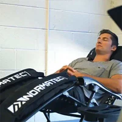 A patient using Normatec decompression technology